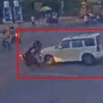 SUV driver jumps red light, hits biker