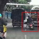 Lucky escape! Two-wheeler rider avoids getting crushed under a truck