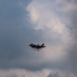 black fighter plane in sky